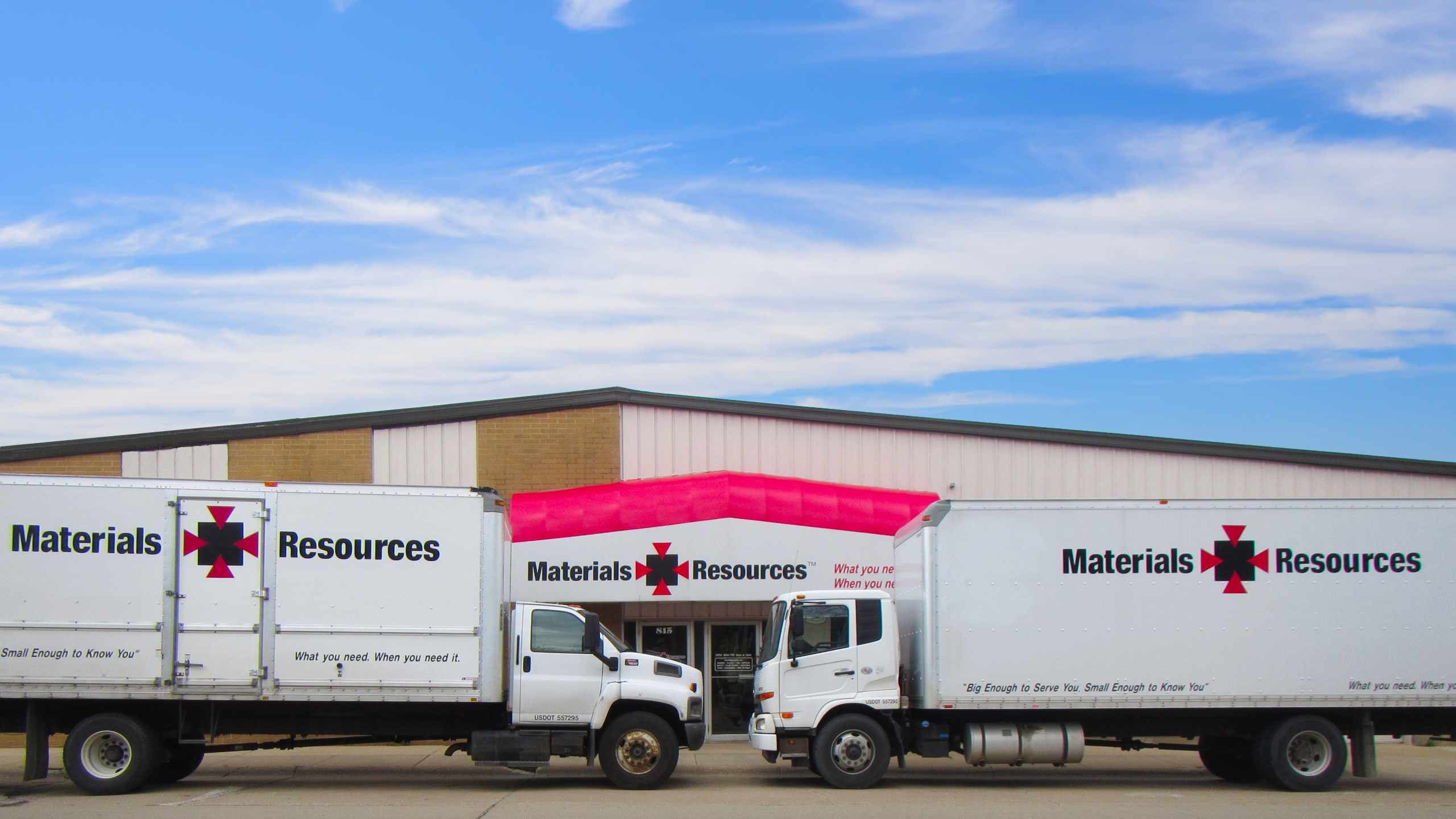 Materials Resources storefront with trucks parked in front